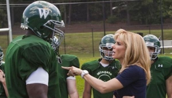 In what's looking to be more and more like a Sandra Bullock Oscar vehicle, The Blind Side is getting just above average reviews across the board. Based on the book by Michael Lewis about the importance of a good left tackle in football, the film focuses on the storyline of Michael Oher, the current right tackle for the Baltimore Ravens, and his upbringings. Though Entertainment Weekly called it a "feel good movie," Melissa Anderson of the Village Voice says it "peddles the most insidious kind of racism, one in which whiteys are virtuous saviors, coming to the rescue of African-Americans who become superfluous in narratives that are supposed to be about them." Yeah, and Bullock's accent is way over the top.